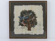 A framed and mounted study of an illuminated tree with birds upon, all painted on papyrus, signed