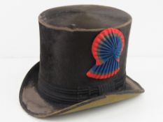 A French 19thC coachman's black silk top hat having red,