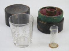 A medicine glass and minim measure by Barclay & Sons Ltd London in original fitted leather box.
