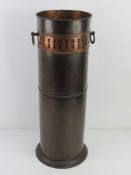 An arts and crafts hand planished copper walking stick / umbrella stand with drip tray, all standing