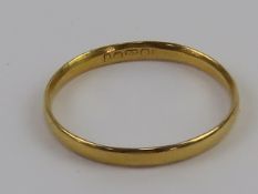 A 22ct gold ring, plain D shaped band hallmarked for Birmingham, size N-O, 1.4g.