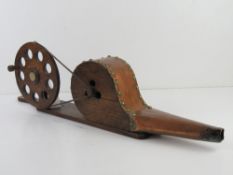 An oak and copper set of mechanical fire bellows having brass stud work throughout and measuring