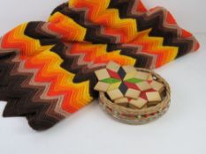 A retro hand knitted 1970s blanket measuring 134 x 92cm. Together with a set of six 1970s coloured