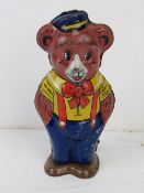 A tin plate clockwork walking Teddy bear by J Chein & Co USA measuring approx 11.5cm high.