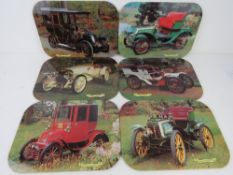 A set of six vintage motor car themed place mats inc Fiat 1903, Renault 1906, Panhard Lavassor 1903,