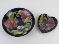 Moorcroft; a round dish 18.5cm dia, together with a heart shaped smaller dish.