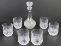 A set of six Whiskey tumblers together with matching decanter.