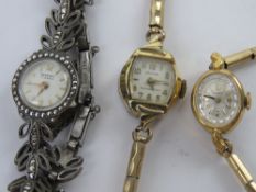 A hallmarked silver and marcasite ladies cocktail wristwatch by Regency together with two other