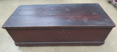 A Victorian stained pine lidded trunk with end handles, 83 x 36 x 25cm.