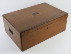 A Victorian oak lidded box having countersunk swing brass handles to each side, cabachon recess