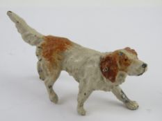 A hand painted cast aluminium figure of an English Setter measuring 11cm in length.