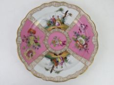 A continental cabinet plate in pink and white ground with floral decoration and figures upon, gilt