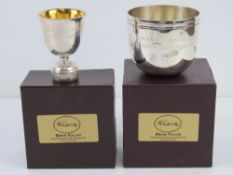 A HM silver presentation bowl together with a HM silver presentation bottle top trophy, each in