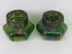 A pair of early 20thC green lustre glass potpourri pots of hexagonal form.