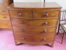 A Victorian bow fronted chest of two short over three long drawers in mahogany all with matching
