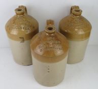 Three salt glazed stoneware jug 'J M Vernon Northampton & Towcester', each 31cm high