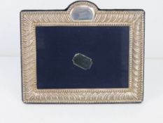 A HM sterling silver photograph frame aperture 14 x 9cm, hallmarked Sheffield.