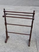 A turned mahogany Victorian free-standing towel rail measuring 70cm wide.