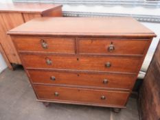 A 19th century elm chest of two short over three long drawers raised over turned legs, matching