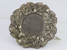 A silver plated foliate themed circular easel mirror, 21cm dia.