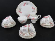 A Paragon China tea service comprising six trios (cups, saucers, side plate), milk jug, sugar bowl