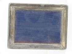 A HM silver photograph frame, 12 x 8.5cm aperture.