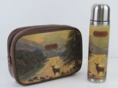 Ted Baker; a stainless steel flask having stag and Scottish Loch scene upon together with matching