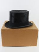 A black beaver silk top hat by Thomas Abbotson Paris, London, retailed by Henry Smith 95 Kings