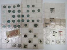 A 1573 Elizabeth I silver coin, together with a 1711 Anne silver coin,