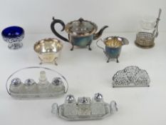 A silver plated tea set comprising teapot, sugar and milk jug together with two chrome cruet sets