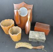 An Edwardian hallway mirror having two brushes upon, together with two wooden planters,