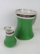 A Bisto England ceramic wash jug with matching bud vase in green and white ground with black