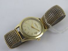 A Favra-Leuba Bovet Daymatic wristwatch having champagne dial with day aperture.