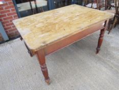A farmhouse type pine kitchen table c1880s single large end drawer and all raised over turned