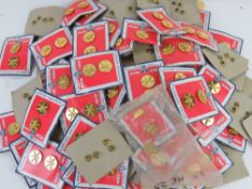 Sixty-eight pairs of Armour Corp button badges.