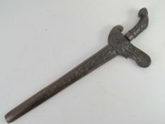 A Kris knife with scabbard having gold gilt blade, with hand crafted and carved scabbard and handle.