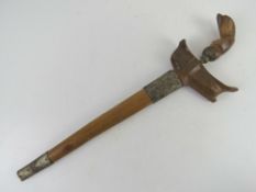 A Kris knife with scabbard.