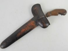 A Kris dagger with scabbard.