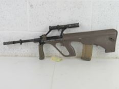 A deactivated Steyr AUG 5.56mm Assault Rifle.