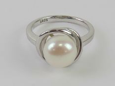 A silver and pearl ring stamped 925, size L.
