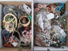 A large quantity of assorted costume jewellery including goldstone bead necklace,