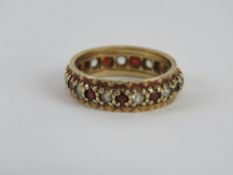 A 9ct gold eternity ring, one stone deficient, size K, 2.87g.
