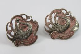 Art Nouveau - a pair of circa 1900 enamelled cast Continental white metal cufflinks.