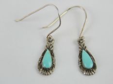 A pair of silver and turquoise earrings stamped 925. In presentation box.