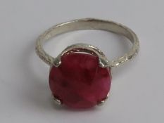 A ruby matrix ring, marked Israel and stamped 925, size R.
