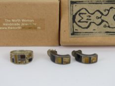 A Native American jewellery set with black onyx tiger's eye and jasper, unmarked white metal,