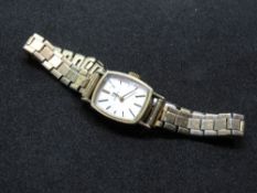 A vintage 9ct gold Omega ladies cocktail watch on Montal gold plated strap, silvered dial,