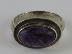 A purple hard stone ring, no apparent hallmarks, size P-Q.