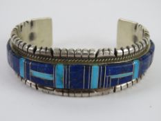 A Native American bangle set with turquoise and lapiz lazuli, a/f,