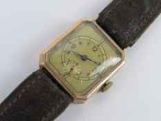 A 9ct gold Art Deco tank watch hallmarked for 1936 having gilded dial with subsidiary seconds dial